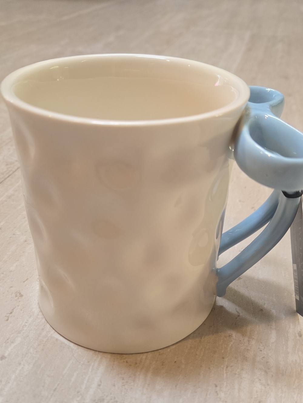 New Bombay White Dimpled Ceramic Mug with Bow Handle